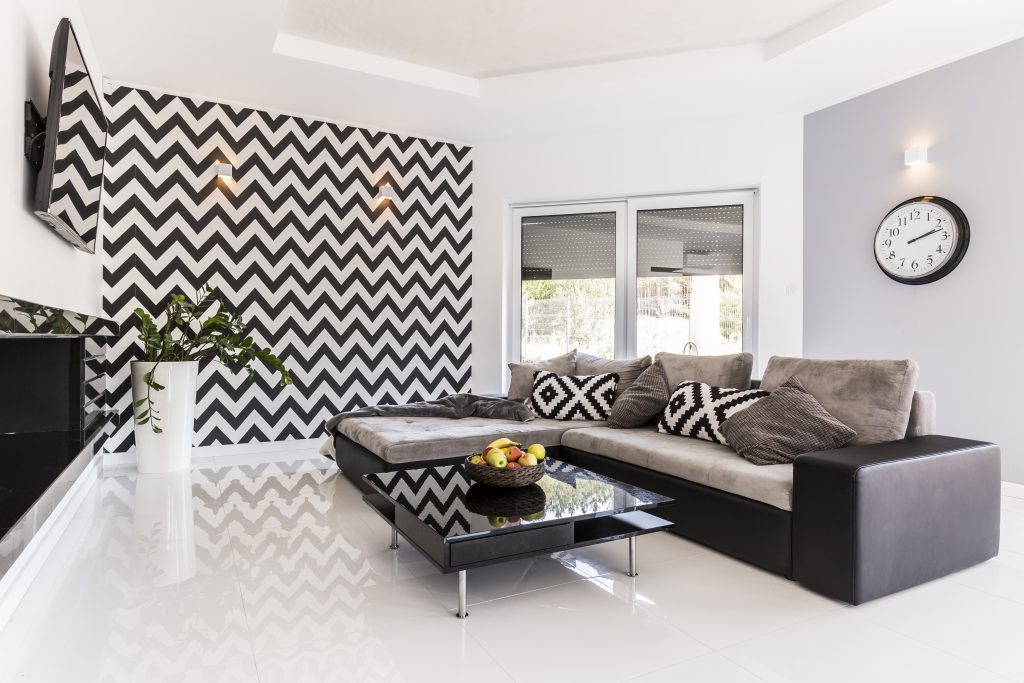 A modern living room with freshly painted walls, showcasing the clean and polished results of professional painting services.